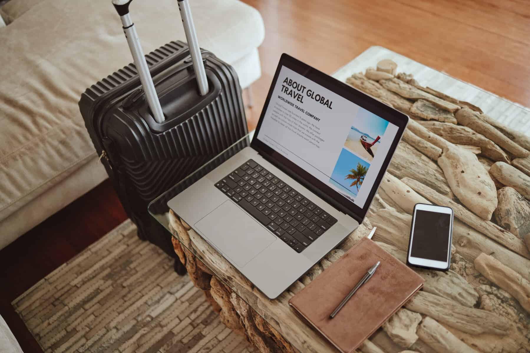laptop screen travel website and suitcase backgro 2023 01 13 03 17 17 utc